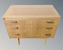 A mid 20th century teak three drawer chest