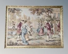 A large gilt framed tapestry depicting figures in a garden