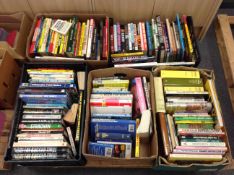 A pallet containing five boxes of books relating to football and cricket