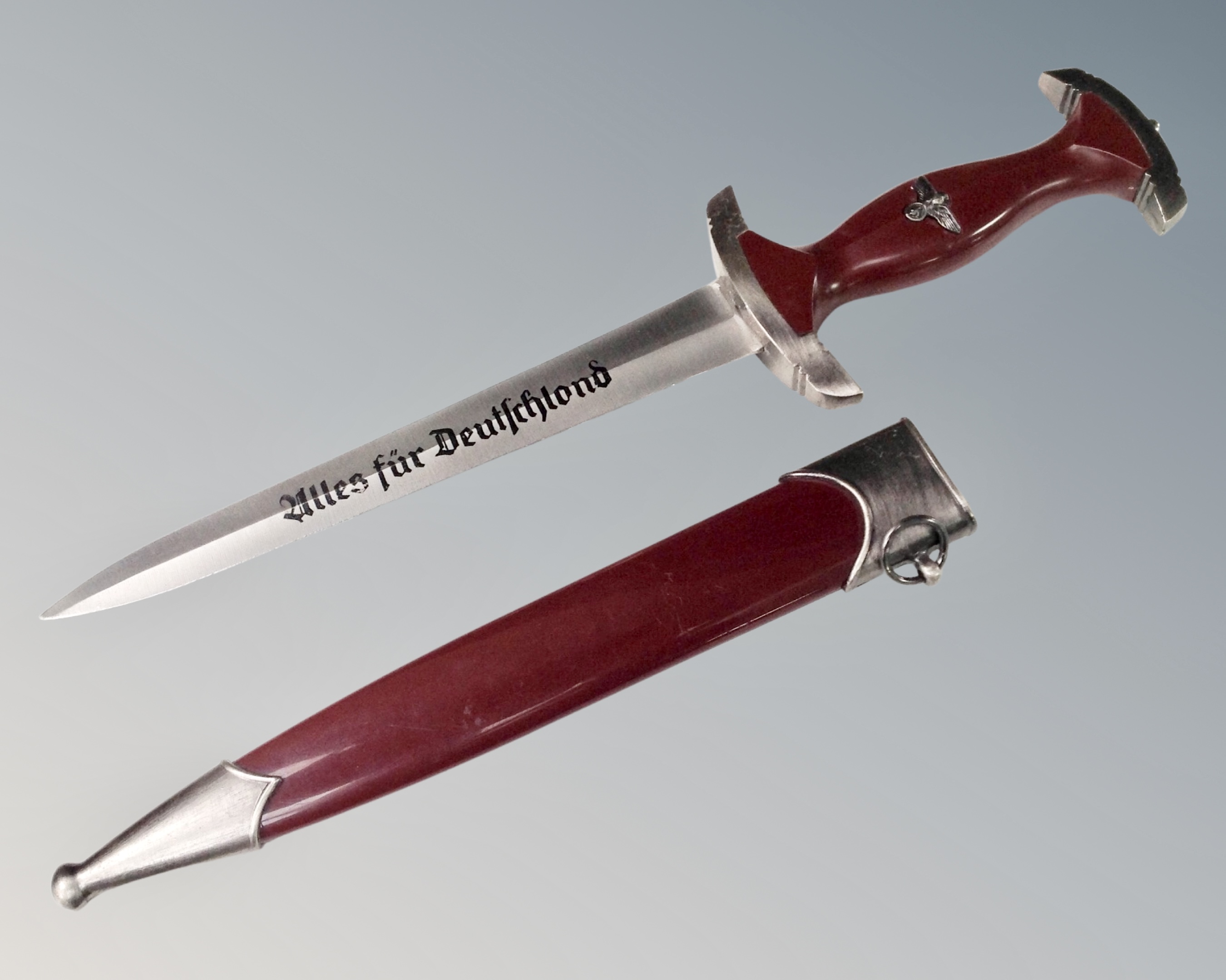 A reproduction German Third Reich dagger in sheath
