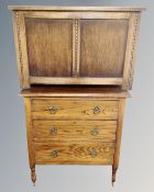 A 1930's oak three drawer chest together with oak panelled blanket box