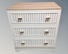 A contemporary three drawer chest