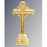 A gilt wood altar crucifix.