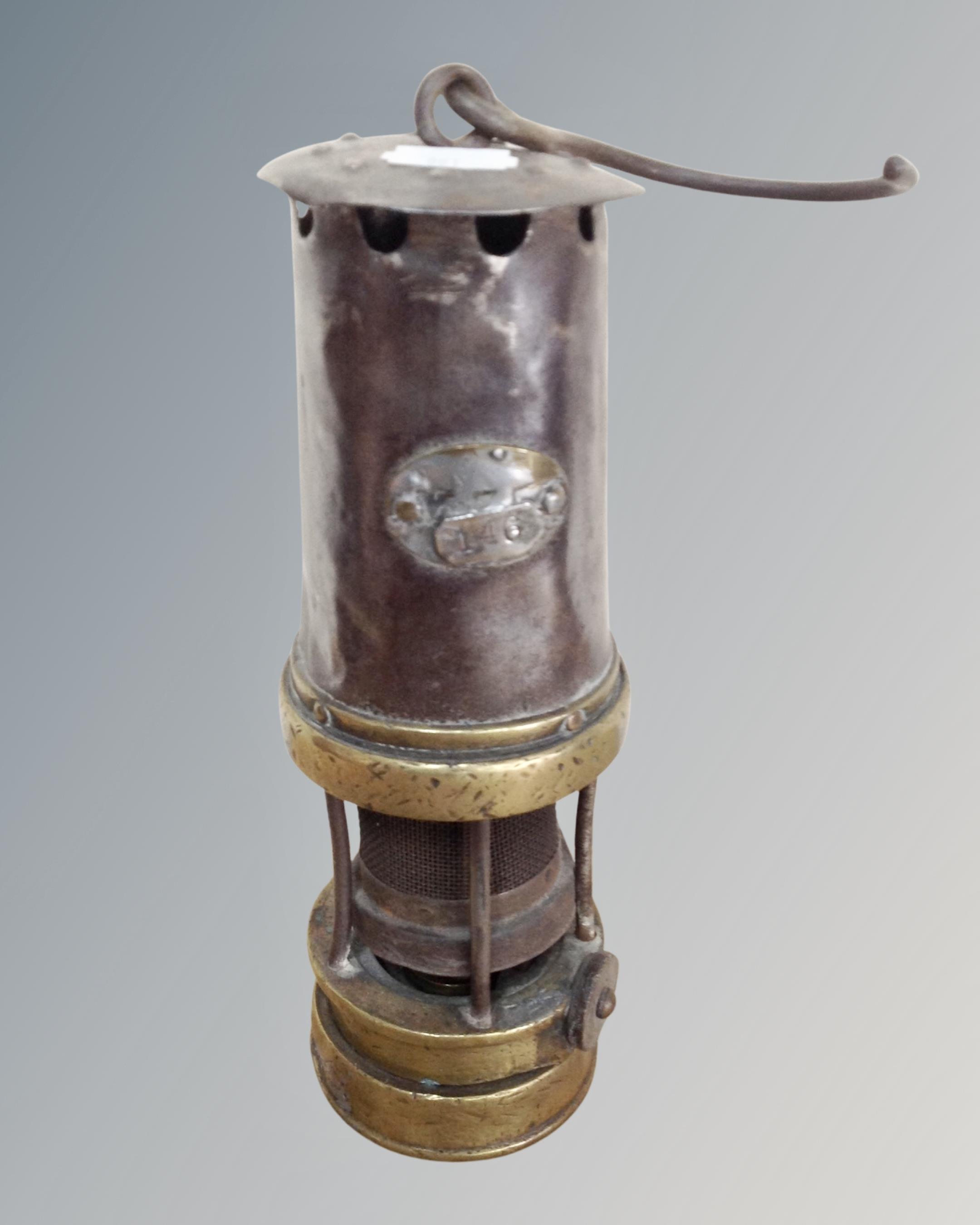 A 19th century steel and brass miner's lamp