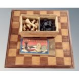 A boxwood chess set in original box French, together with board, King 5.5 cm.