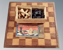 A boxwood chess set in original box French, together with board, King 5.5 cm.