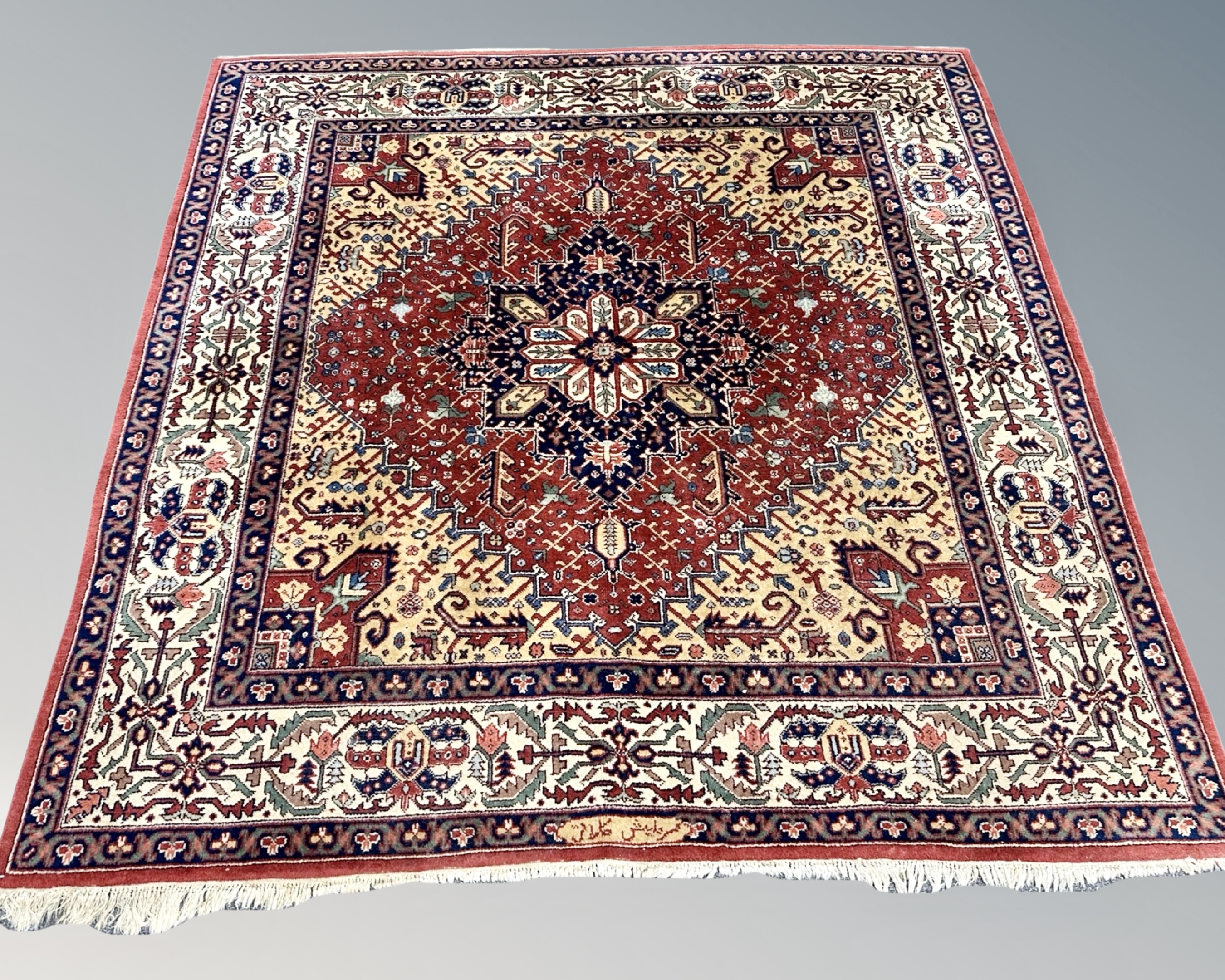 A Heriz rug, Iranian Azerbaijan, signed,