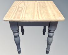A pine square farmhouse table on painted legs