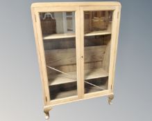 A 20th century oak double door glazed bookcase by CWS Ltd