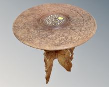 A carved Indian inlaid hardwood occasional table