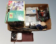 A box containing leather cased meter, garden pump kit, G-clamp, compact vacuum,
