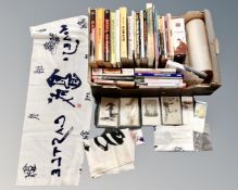 A box of Japanese related DVD's, books on karate and martial arts, book marks,