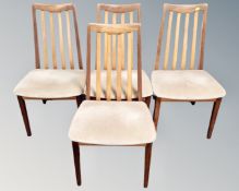 A set of four mid century teak G-plan rail backed dining chairs