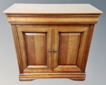 An Ernest Menard double door cabinet