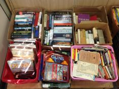 A pallet containing seven boxes of books relating to guns, history, Churchill,