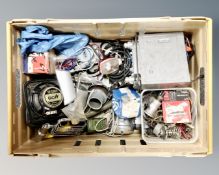 A crate of vintage car parts,