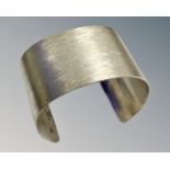 A Sterling silver cuff bangle, 58g, width 4 cm.