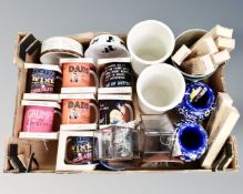 A box of new mugs, tea light holders, vases, kitchen storage jars,
