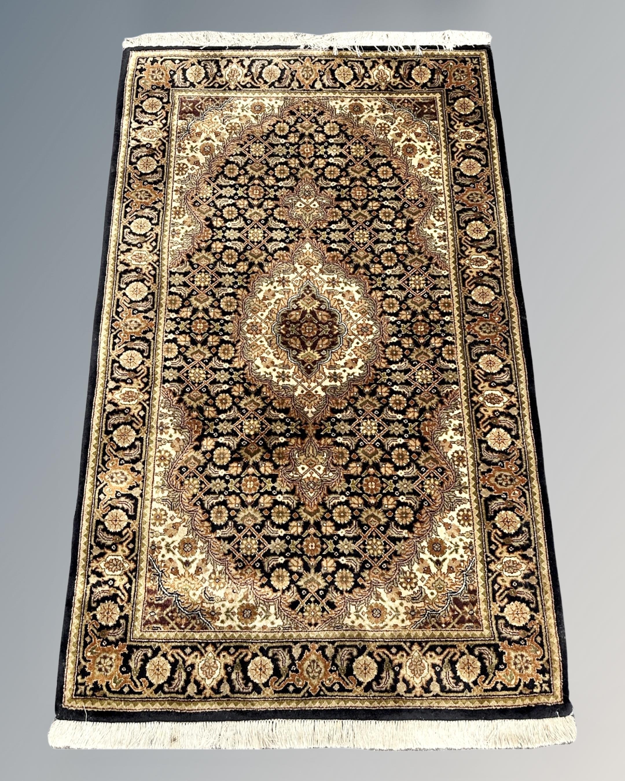 A Tabriz design rug,