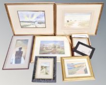 A box of picture frames, framed watercolours and signed prints,