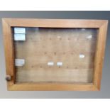 A pine framed wall mounted key cabinet