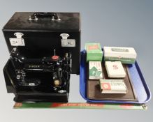 A scarce Singer 222k sewing machine in box together with various Singer accessories.