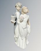 A Lladro figure of a bride and groom,