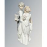 A Lladro figure of a bride and groom,