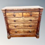A Victorian mahogany five drawer chest with pillar supports,