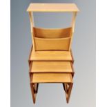 A nest of three 20th century teak G-Plan tables together with a further teak magazine rack
