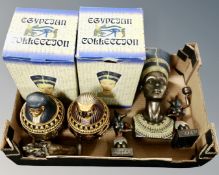 A box containing Egyptian collection figures.