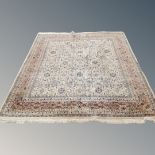 An Indian carpet on cream ground,