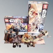 A Lego Star Wars 75137 Carbon Freezing Chamber together with a Lego Star Wars 75174 Desert Skiff