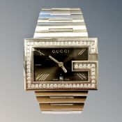 A Gentleman's Gucci wristwatch set with diamonds, the 58 diamonds approximately 1.4ct.