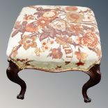 A French mahogany dressing table stool on cabriole legs