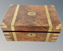 A Victorian walnut brass bound fitted travelling writing box.