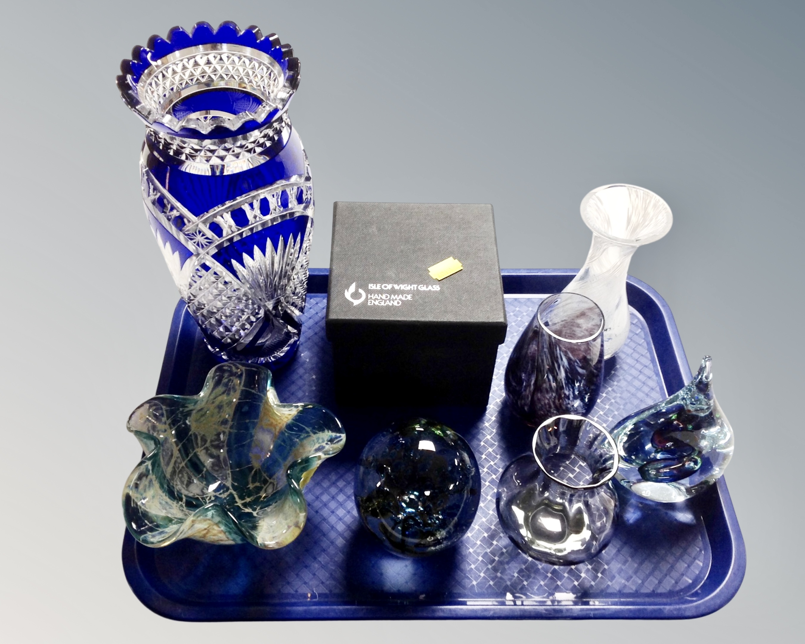 A tray containing assorted glassware including an Isle of Wight paperweight in box and further