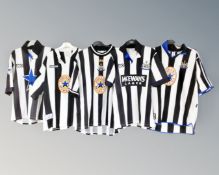 Five Newcastle United 1990s ASICS and Adidas replica home shirts.