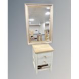 An Ercol Pinto two drawer bedside cabinet together with a contemporary bevelled mirror