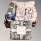 A box containing three Sleepdown cosy collection throws together with two further fleece blanket