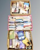 Three boxes of books including paperback novels, romance etc.