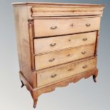 A 19th century oak five drawer chest on raised feet.