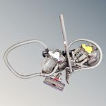 A Dyson DC19 T2 cylinder vacuum together with a further Dyson cylinder vacuum,
