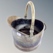 A Victorian brass swing handled coal bucket.