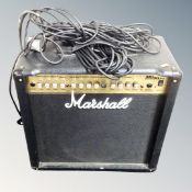 A Marshall MG series 50 DFX amplifier with leads.