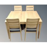 An Ercol Romana extending dining table in oak with matte lacquer finish,