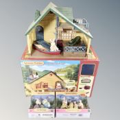 A Sylvanian Families log cabin play set together with Marguerite Rabbit Family 5507 and Polar Bear