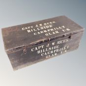A vintage metal footlocker bearing the name Captain J W Rees Hillside Caerphilly Glamorgan UK