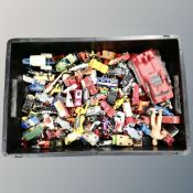 A box containing a quantity of play worn die cast and plastic vehicles including Corgi juniors 007