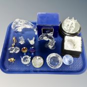 A tray containing assorted crystal paperweights and animal ornaments.